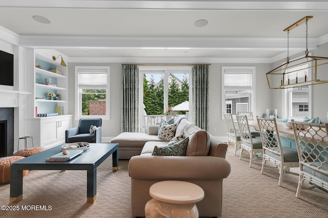 29 Allen St, Rumson, NJ 07760 - carpeted living room with healthy amount of natural light, a fireplace, ornamental molding, and built in shelves