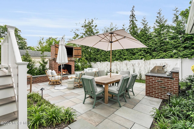 29 Allen St, Rumson, NJ 07760 - view of patio featuring an outdoor brick fireplace, exterior kitchen, and outdoor dining area