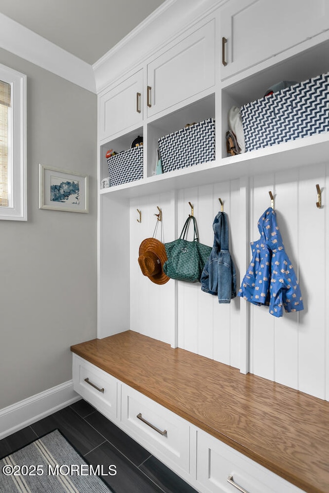 29 Allen St, Rumson, NJ 07760 - mudroom featuring dark tile patterned flooring and crown molding