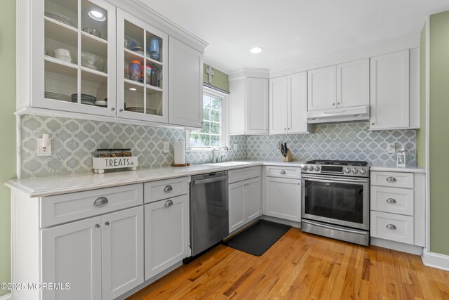 623 Forecastle Ave, Beachwood, NJ 08722 - kitchen featuring stainless steel appliances, under cabinet range hood, light countertops, light wood finished floors, and recessed lighting