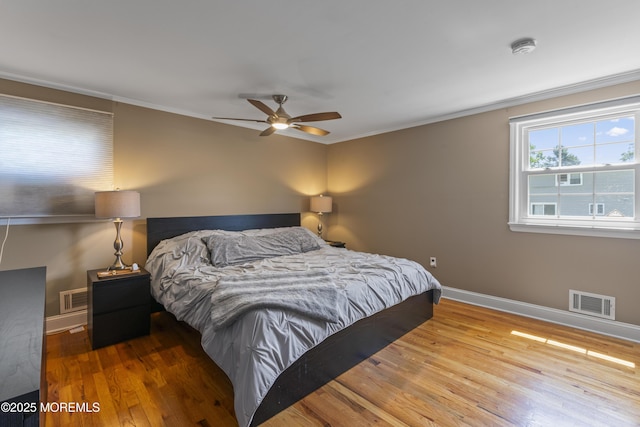 623 Forecastle Ave, Beachwood, NJ 08722 - bedroom with wood finished floors, crown molding, and ceiling fan
