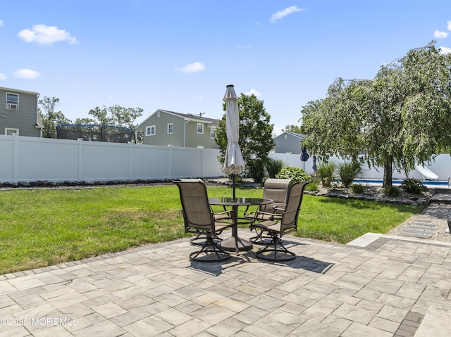 623 Forecastle Ave, Beachwood, NJ 08722 - fenced backyard with a patio and outdoor dining area
