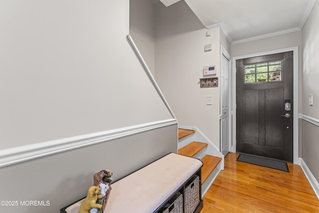 623 Forecastle Ave, Beachwood, NJ 08722 - entryway with light wood-style floors, crown molding, and stairs