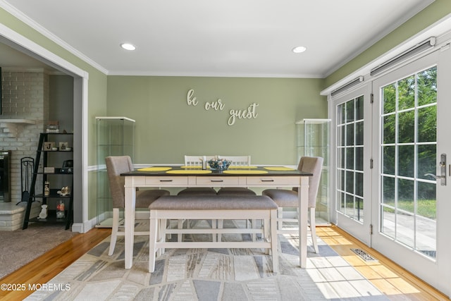 623 Forecastle Ave, Beachwood, NJ 08722 - dining space featuring healthy amount of natural light, wood finished floors, crown molding, recessed lighting, and french doors