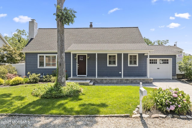 623 Forecastle Ave, Beachwood, NJ 08722 - view of front of home with covered porch, an attached garage, a front yard, and a chimney