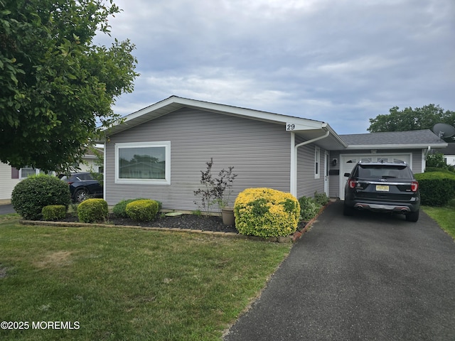29 Keats Rd, Brick, NJ 08723 - view of side of home featuring a garage, a yard, and driveway