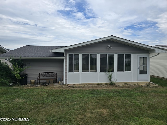 29 Keats Rd, Brick, NJ 08723 - back of property featuring a shingled roof, a sunroom, and a yard
