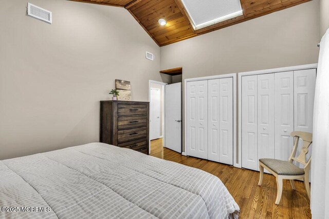 208 Chatham Ln, Point Pleasant, NJ 08742 - bedroom with high vaulted ceiling, multiple closets, wood finished floors, and wooden ceiling