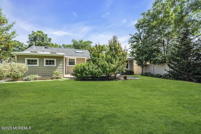 208 Chatham Ln, Point Pleasant, NJ 08742 - back of property featuring a lawn and a shingled roof