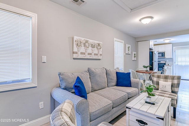241 Hancock Ave, Seaside Heights, NJ 08751 - living area with light wood finished floors and baseboards