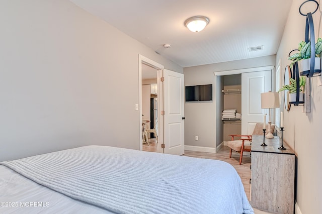 241 Hancock Ave, Seaside Heights, NJ 08751 - bedroom with light wood-style flooring and a closet