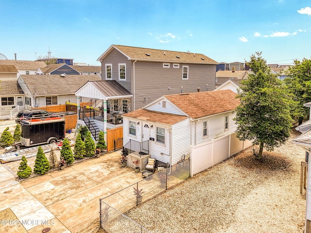 241 Hancock Ave, Seaside Heights, NJ 08751 - rear view of property featuring a fenced backyard, a patio area, a residential view, and a gazebo