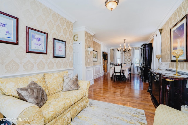 19 Summerhill Ave, Jackson, NJ 08527 - living room featuring wallpapered walls, a chandelier, wood finished floors, ornamental molding, and a wainscoted wall