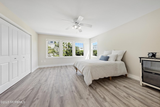 41A Long Beach Blvd, Long Beach Twp, NJ 08008 - bedroom with light wood-style floors, a closet, and a ceiling fan