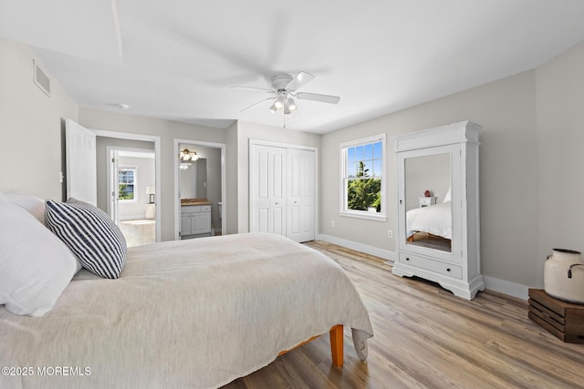 41A Long Beach Blvd, Long Beach Twp, NJ 08008 - bedroom featuring wood finished floors, ensuite bathroom, a ceiling fan, and a closet