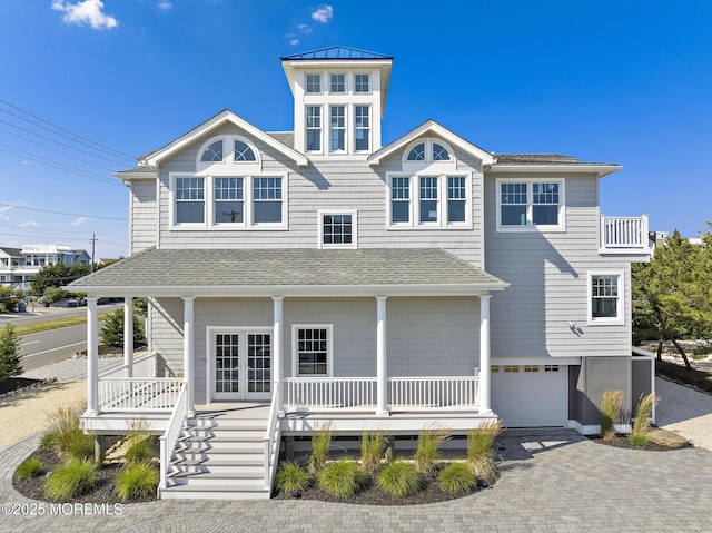 41A Long Beach Blvd, Long Beach Twp, NJ 08008 - coastal home featuring a porch, an attached garage, decorative driveway, and a standing seam roof