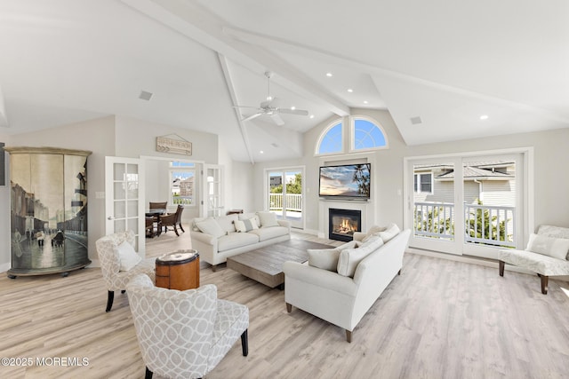 41A Long Beach Blvd, Long Beach Twp, NJ 08008 - living room featuring beamed ceiling, a glass covered fireplace, light wood-type flooring, a ceiling fan, and high vaulted ceiling