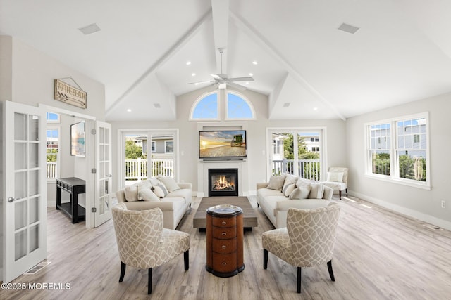 41A Long Beach Blvd, Long Beach Twp, NJ 08008 - living room with french doors, high vaulted ceiling, a glass covered fireplace, wood finished floors, and ceiling fan