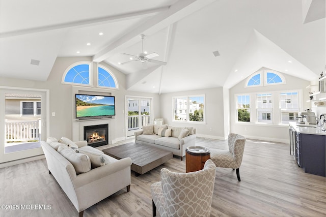 41A Long Beach Blvd, Long Beach Twp, NJ 08008 - living area with light wood finished floors, high vaulted ceiling, a glass covered fireplace, beamed ceiling, and ceiling fan