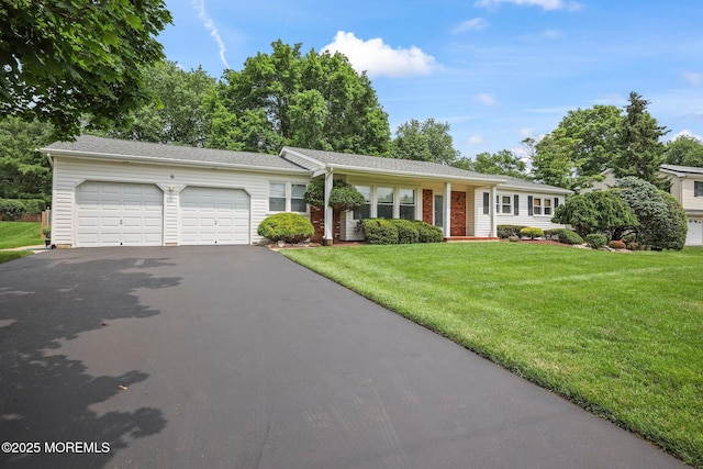 6 Pamela St, Marlboro, NJ 07746 - ranch-style house featuring asphalt driveway, a garage, and a front yard