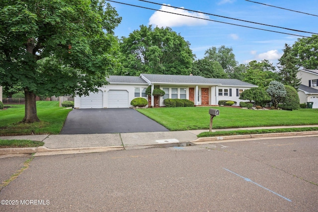 6 Pamela St, Marlboro, NJ 07746 - view of front of property with a front yard, an attached garage, and asphalt driveway