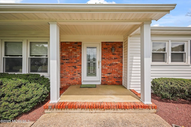 6 Pamela St, Marlboro, NJ 07746 - property entrance featuring covered porch and brick siding
