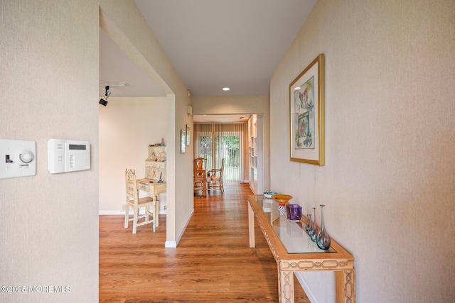 6 Pamela St, Marlboro, NJ 07746 - corridor featuring wood finished floors and track lighting