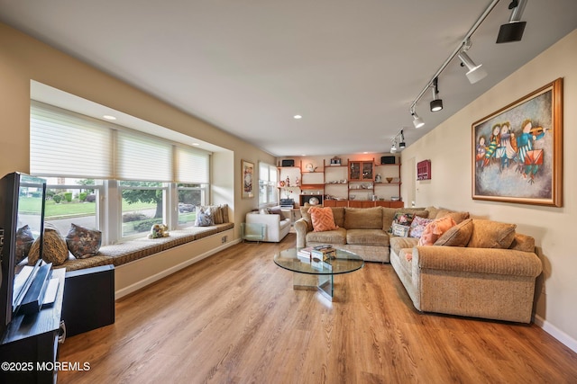 6 Pamela St, Marlboro, NJ 07746 - living area featuring track lighting, wood finished floors, and recessed lighting