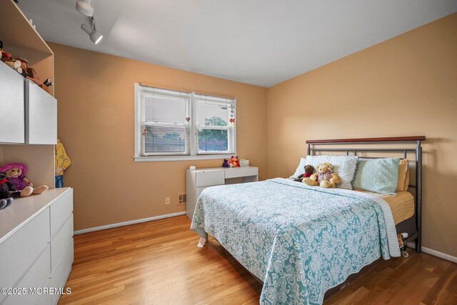 6 Pamela St, Marlboro, NJ 07746 - bedroom with light wood finished floors and baseboards