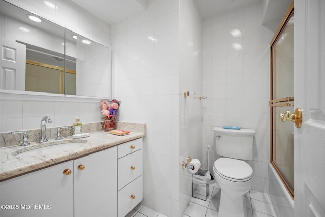 6 Pamela St, Marlboro, NJ 07746 - full bath featuring tile walls, vanity, tile patterned floors, and combined bath / shower with glass door