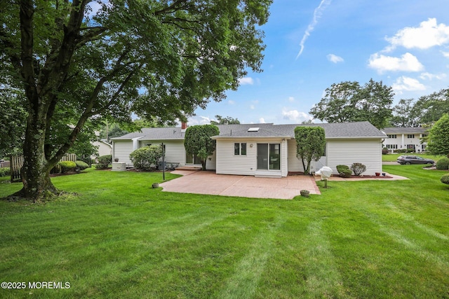 6 Pamela St, Marlboro, NJ 07746 - back of property featuring a patio and a lawn