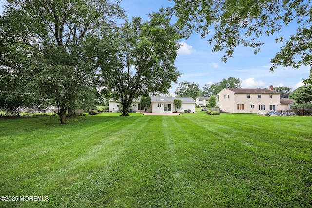 6 Pamela St, Marlboro, NJ 07746 - view of green lawn featuring a patio area