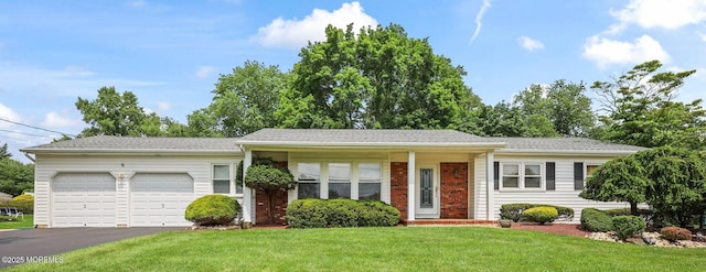 6 Pamela St, Marlboro, NJ 07746 - ranch-style house with an attached garage, a front yard, and asphalt driveway