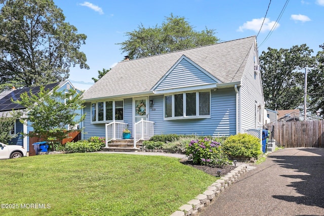 505 Moore Rd, Neptune Township, NJ 07753 - view of front facade featuring roof with shingles, asphalt driveway, and a chimney
