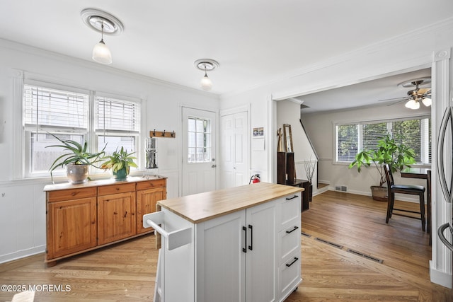 505 Moore Rd, Neptune Township, NJ 07753 - kitchen with wooden counters, crown molding, light wood-style flooring, and a ceiling fan
