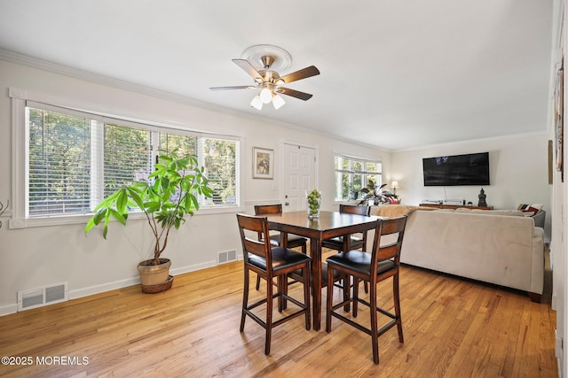 505 Moore Rd, Neptune Township, NJ 07753 - dining area featuring ceiling fan, light wood finished floors, and ornamental molding