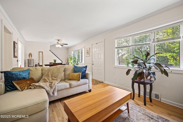 505 Moore Rd, Neptune Township, NJ 07753 - living room with healthy amount of natural light, ornamental molding, light wood-style floors, and ceiling fan