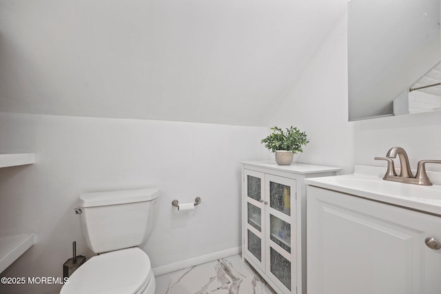 505 Moore Rd, Neptune Township, NJ 07753 - bathroom with vanity, marble finish flooring, and lofted ceiling