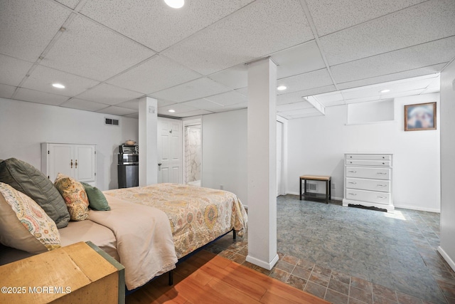 505 Moore Rd, Neptune Township, NJ 07753 - bedroom featuring recessed lighting, a paneled ceiling, fridge, and stone finish floors