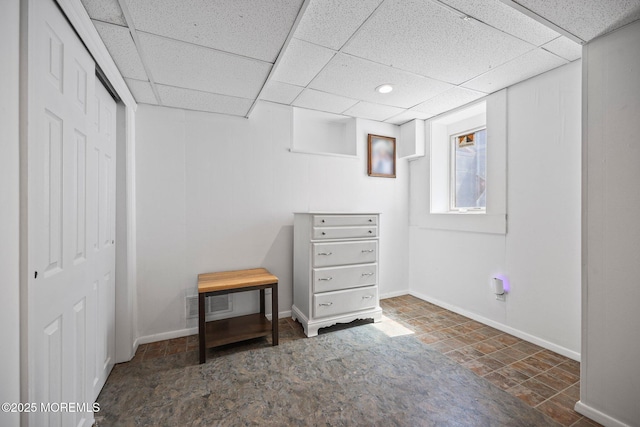 505 Moore Rd, Neptune Township, NJ 07753 - below grade area featuring baseboards and a paneled ceiling