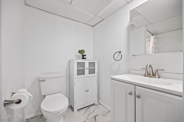505 Moore Rd, Neptune Township, NJ 07753 - bathroom with vanity, a drop ceiling, and marble look tile flooring