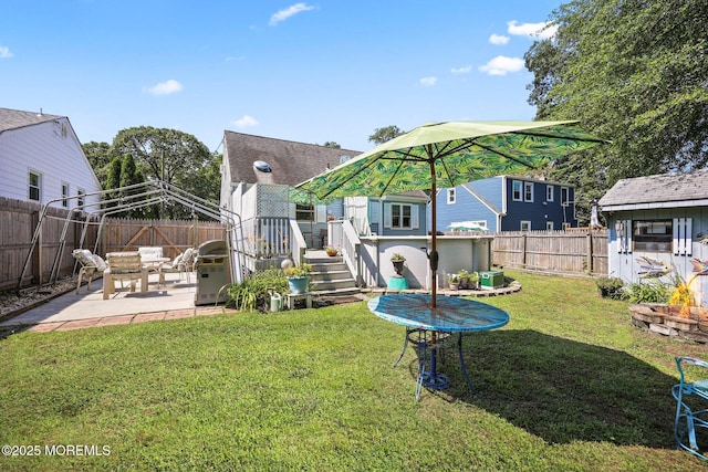 505 Moore Rd, Neptune Township, NJ 07753 - fenced backyard with a patio, a deck, and a storage shed