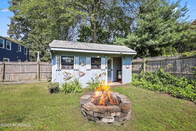 505 Moore Rd, Neptune Township, NJ 07753 - view of shed with a fire pit and a fenced backyard