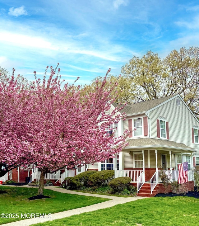 117 Lexington Ct, Holmdel, NJ 07733 - view of front of property with covered porch, a front lawn, and a shingled roof