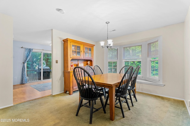 117 Lexington Ct, Holmdel, NJ 07733 - dining area with a chandelier and light colored carpet