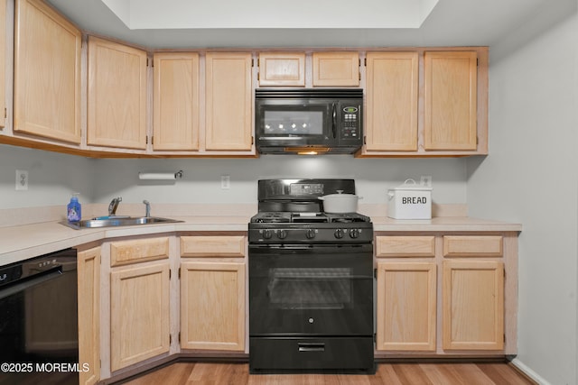 117 Lexington Ct, Holmdel, NJ 07733 - kitchen featuring black appliances, light brown cabinetry, and light countertops