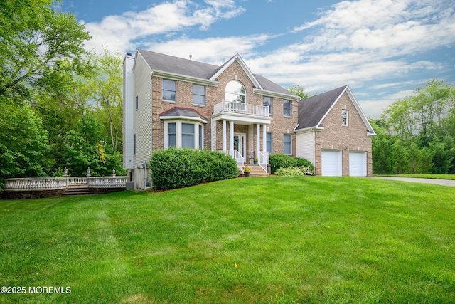 235 Leesville Rd, Jackson, NJ 08527 - colonial-style house featuring brick siding, a chimney, a front lawn, and a detached garage