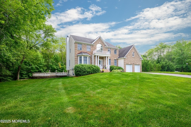 235 Leesville Rd, Jackson, NJ 08527 - colonial inspired home featuring brick siding, a front yard, and a chimney