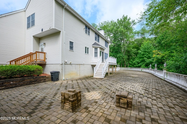 235 Leesville Rd, Jackson, NJ 08527 - view of side of home with a patio area, stairs, a deck, and a chimney