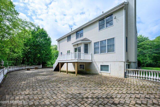 235 Leesville Rd, Jackson, NJ 08527 - back of property with a patio area, stairway, and a wooden deck